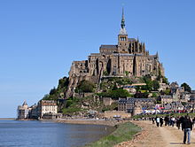 Mont Saint-Michel a hill monastery in a wetland, with the tide out