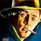 Detail of a man wearing a fedora and smoking a cigarette