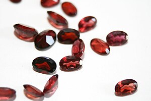 English: a collection of oval Garnets in light...