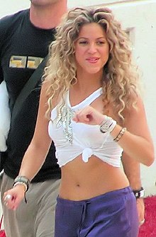 A young woman with curly long hair.