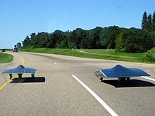 Solar cars from University of Michigan and University of Minnesota heading west toward the finish line in the 2005 North American Solar Challenge Solar Vehicles - Winnipeg.jpg