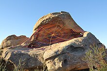 Stephen Duneier's Spiderweb Yarnbomb installation hides and highlights previous graffiti. Spiderweb Yarnbomb Installation by Stephen Duneier.JPG