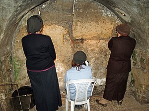 Women praying in the Western Wall tunnels. Thi...