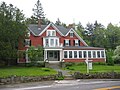 Cranberry Lodge, one of the inn's six adjacent accommodations. The section from the steps and to the right is the original part of the structure