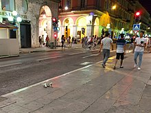 A pair of shoes lie on the ground in the rush shortly after the attack 2016 Nice attack shoes abandoned IMG 20160714 224859.jpg