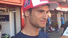 Arthur SIssis como piloto de Red Bull de Moto3 en el pit walk del GP de Catalunya.