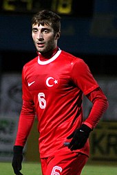 Man in red sports clothing wearing gloves