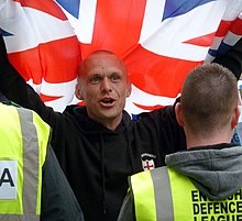 A participant in an EDL rally in Newcastle in 2010, carrying the Union Jack flag Edl5.jpg