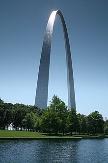 The St. Louis Gateway Arch, an iconic symbol of high modernity and its outlook, along with its modern urban planning project of a surrounding large park and car centric infrastructure. Gateway arch reflect 1.jpg