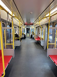 Interior of a #4 CRRC car MBTA Red Line 1907 interior nearing JFK-UMass station, February 2023.jpg