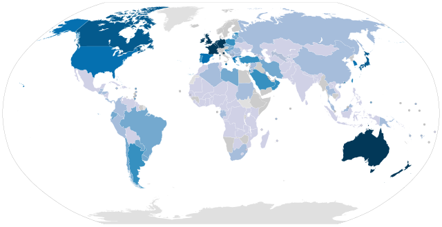 World map, countries colored in different shades of blue by minimum wage