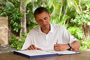 English: President Barack Obama signs H.R. 847...