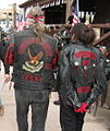 Two bikers, wearing colors on their cut-off (left) and tasseled leather jacket (right) in 2006