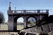 Ruins of the Old 1913 Ash Avenue Bridge. The bridge was built with a narrow span which was designed more for wagons and couldn’t handle two lanes of traffic. bridge closed to vehicles when the Mill Avenue Bridge opened in 1931. The bridge needed repairs, however the city of Tempe decided to demolish it in 1991. (NRHP)