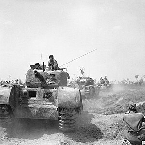 Churchill tanks being filmed by an AFPU cameraman during the advance of 56th Division north-east of Argenta, Italy, 17 April 1945. NA24288.jpg