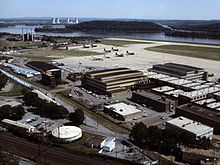 Three Mile Island in background behind Harrisburg International Airport, a few weeks after the accident Harrisburg Int Airport with Pennsylvania ANG aircraft 1979.jpg