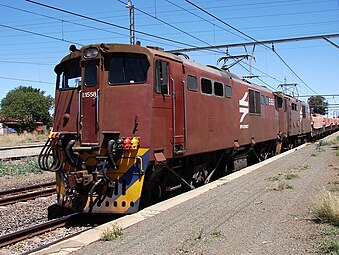 No. E1558 in an incorrect Spoornet maroon livery with “SPOORNET” at Orkney, 13 October 2009