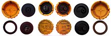 Radiator caps for pressurized automotive cooling systems. Of the two valves, one prevents the creation of a vacuum, the other limits the pressure. Tappo pressurizzato.jpg