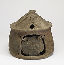 Etruscan cinerary hut-urn (Villanovan period, 9th-8th century BC), showing the likely shape of an early hut: a simple mud-and-straw shelter Villanovan - Urn in the Shape of a Hut and a Door - Walters 482312.jpg