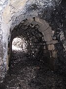 Transition from the rock to cut masonry arch inside the tunnel, picture from the south.