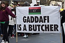 An anti-Gaddafist placard being displayed by demonstrators in Ireland in 2011 Gaddafi Is a Butcher - Libyan Protest Meeting In Dublin.jpg