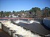 A stepped labyrinth spillway and dam