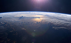 Sunset over the Pacific Ocean as seen from the International Space Station. Tops of thunderclouds are also visible. Iss007e10807.jpg