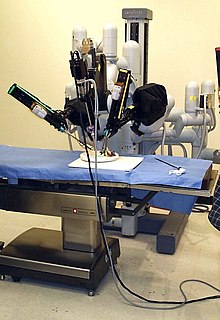 A laparoscopic robotic surgery machine. Patient-side cart of the da Vinci surgical system. Laproscopic Surgery Robot.jpg