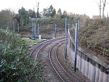 A photo of the junction, showing two tightly curved tram tracks meeting in a fork.