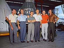 (L to R) Cooper, Schirra (partially obscured), Shepard, Grissom, Glenn, Slayton, and Carpenter Mercury Seven.jpg