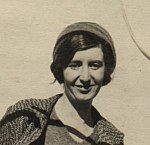 Cropped Black-and-white photograph of a woman on a ship wearing a hat in 1931