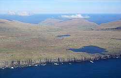 Island of Sandoy seen from a helicopter.