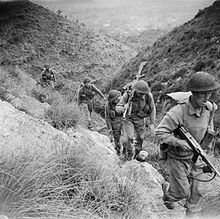 Men of the 10th Battalion, Royal Berkshire Regiment, part of the 168th Brigade of the British 56th Division, climbing the heights of Calvi Risorta shortly after the invasion of Italy, October 1943. The British Army in Italy 1943 NA8236.jpg