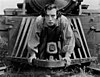 Buster Keaton on the cowcatcher of a locomotive during filming of "The General"