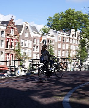 English: A bicyclist in Amsterdam, the Netherl...