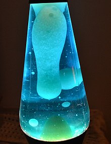 A lava lamp contains two immiscible liquids (a molten wax and a watery solution) which add movement due to convection. In addition to the top surface, surfaces also form between the liquids, requiring a tension breaker to recombine the wax droplets at the bottom. Blue Lava lamp.JPG