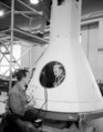 Technicians prepare a full-scale capsule which would be used for the test