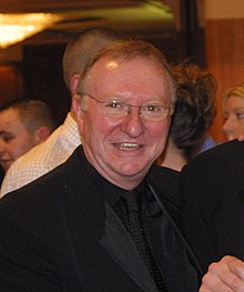 Dennis Taylor, smiling at the camera