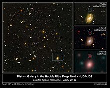 Infrared observations can see objects hidden in visible light, such as HUDF-JD2, shown. This shows how the Spitzer IRAC camera was able to see beyond the wavelengths of Hubble's instruments. HUDF-JD2.jpg