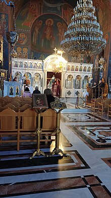 An Orthodox priest in Argos, Greece, conducts a morning liturgy. Liturgical book readers can be seen. Orthodox liturgy, Argos.jpg