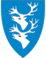 3424 Rendalen I blått to sølv reinsdyrhoder, 1-1 [295] rein er vanlig i kommunen, og antallet, 2, symboliserer at kommunen er sammenslått av to kommuner før 1965.