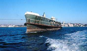 Being towed out of Sydney Harbour for scuttling at sea, August 1980