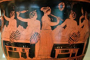 Banqueters playing Kottabos and girl playing the aulos, Greece (c. 420 BCE). Banqueting and music have continued to be two important entertainments since ancient times. Symposium scene Nicias Painter MAN.jpg