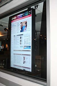 A flat screen monitor on a wall in 30 Rock, showing msnbc.com 111907cc.jpg