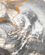 Imagem visível da interação do par de ciclones perto da costa leste às 13:00h EST (08:00h UTC) em 23 de dezembro de 1994.