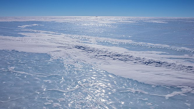 Otter Plain (looking NE) with Sigurd Knolls in the center near the horizon, roughly 27 miles (44 km) in the distance. Queen Maud Land, Antarctica.]]