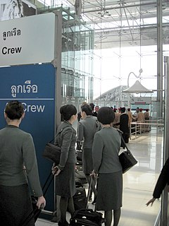 EVA air flight attendants at a aircrew counter of the Immigration Bureau at Suvarnabhumi International Airport - outbound