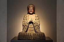 A Ming bronze of the Buddha Mahavairocana, which depicts his body as being composed of numerous other Buddhas. Ming Bronze Vairocana Buddha.jpg