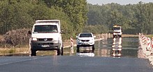 Mirage over a hot road Mirage over a hot road.jpg