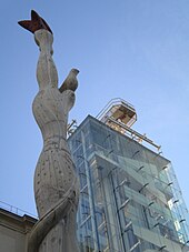 The Museo Nacional Centro de Arte Reina Sofia (MNCARS) is Spain's national museum of 20th-century art, located in Madrid. The photo shows the old building with the addition of one of the contemporary glass towers to the exterior by Ian Ritchie Architects with the closeup of the modern art tower. Museum Reina Sofia Madrid Spain Espana this is a front photo close up at the Queen Sofia Museum in 2011 month of June.jpg